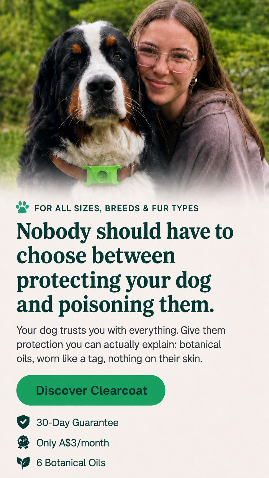 An owner holding her dog wearing the Clearcoat pendant